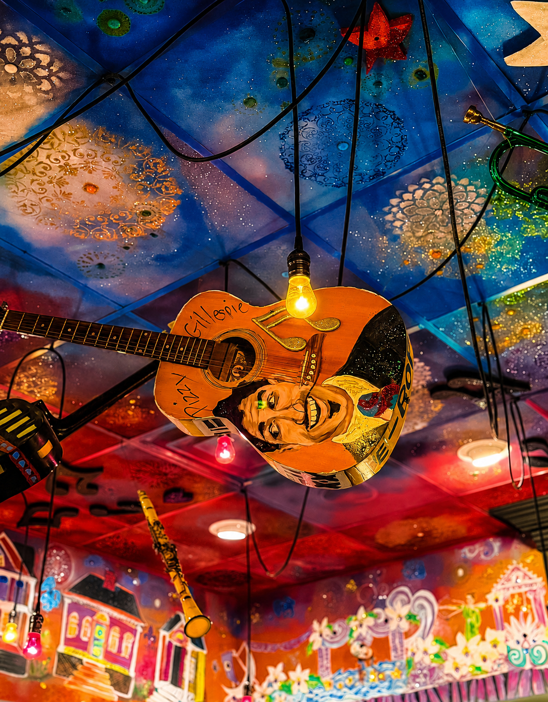 Hand-painted ceiling in the Napoleon Room, with a guitar painted with a musician's portrait