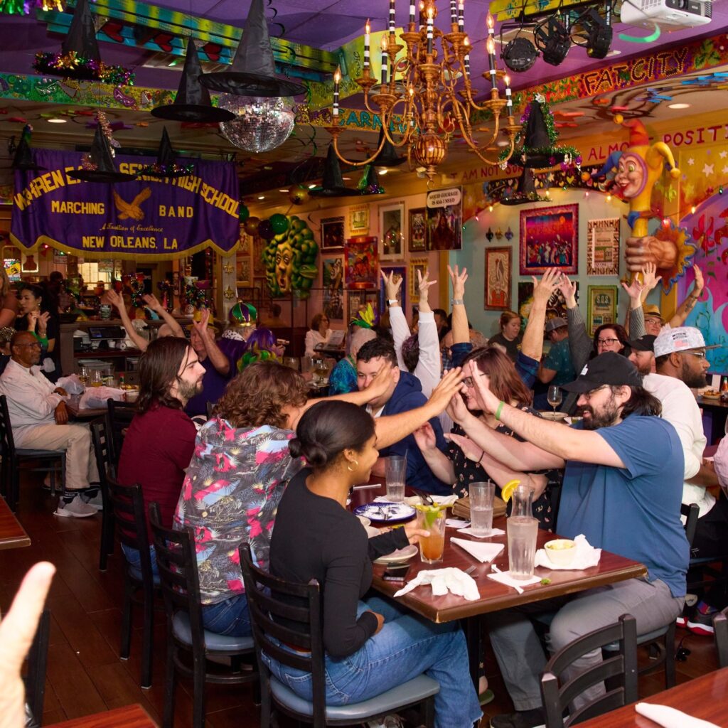 New Orleans brunch dishes and drinks on a table at Tibby's Winter Park